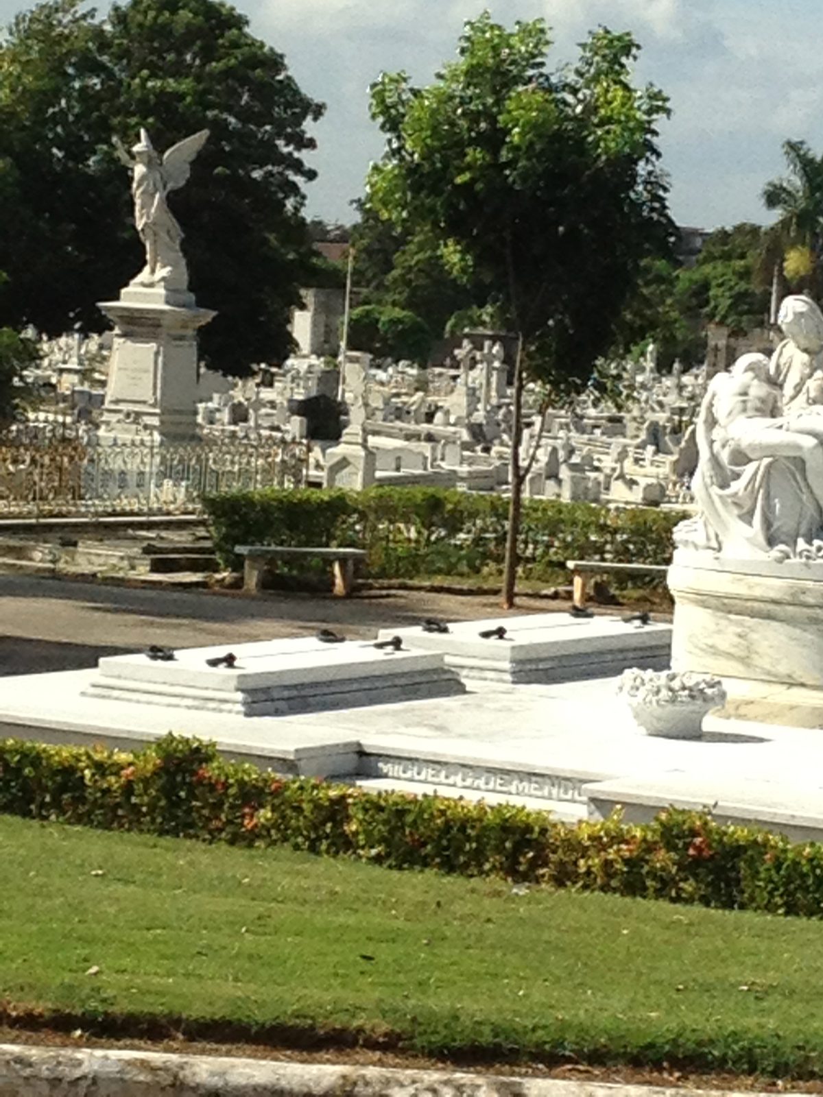 A pieta, caught as the bus drove by.  The burial caverns are reused.  The coffins are stacked...
